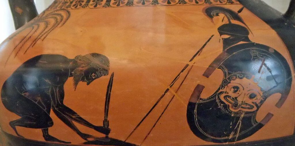 Μελανόμορφη αγγειογραφία του Εξηκία. Ο ήρωας Αίας σκύβει για να στερεώσει το ξίφος του στο έδαφος, ενώ δίπλα του στέκεται η πανοπλία του με μια ασπίδα που φέρει γοργόνειο.