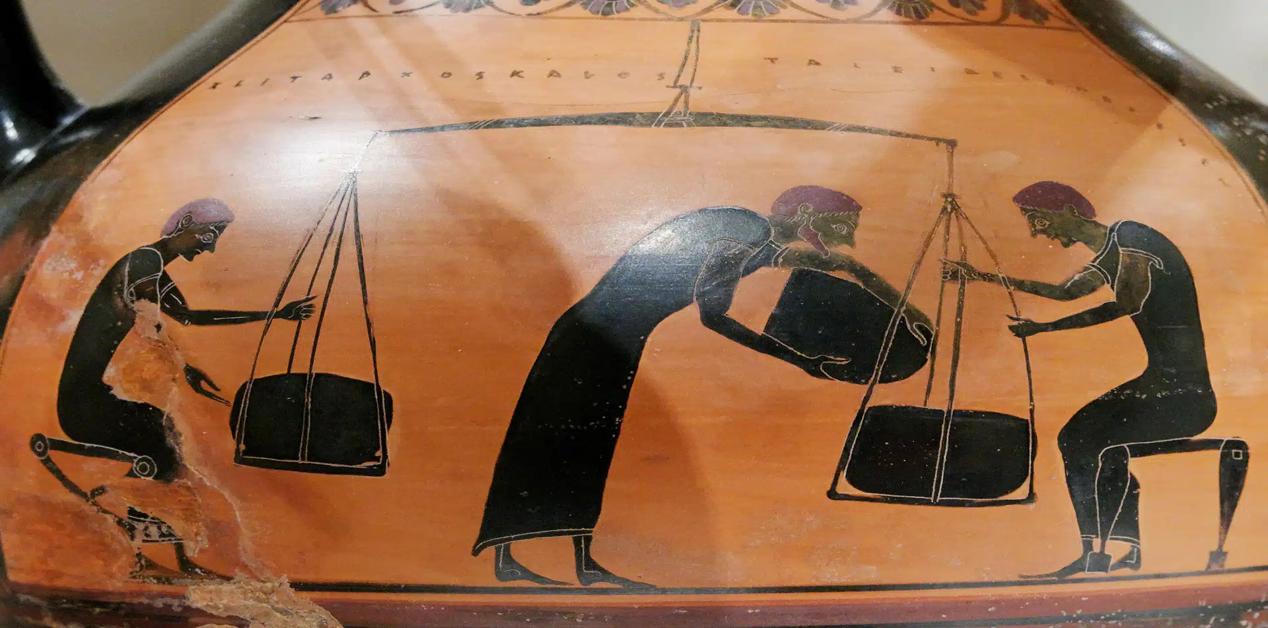 Απεικόνιση αρχαίων Ελλήνων σε αμφορέα να ζυγίζουν εμπορεύματα – πληθυσμός και καθημερινή ζωή στην Αρχαία Ελλάδα