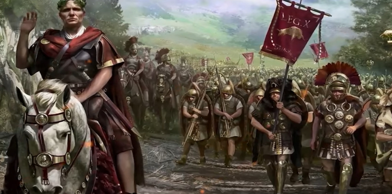 Μια ψηφιακή απεικόνιση του Ιούλιου Καίσαρα ως νεαρού στρατιωτικού ηγέτη, έφιππου σε ένα λευκό άλογο, να χαιρετά το πλήθος. Στο βάθος, μια μεγάλη ρωμαϊκή λεγεώνα παρελαύνει σε ένα καταπράσινο, λοφώδες τοπίο, με τους στρατιώτες να φορούν πανοπλίες και κράνη. Ένας στρατιώτης κρατά ψηλά ένα κόκκινο banner που φέρει την επιγραφή "LEG.X GEMINA", αντιπροσωπεύοντας τη Legio X Gemina.