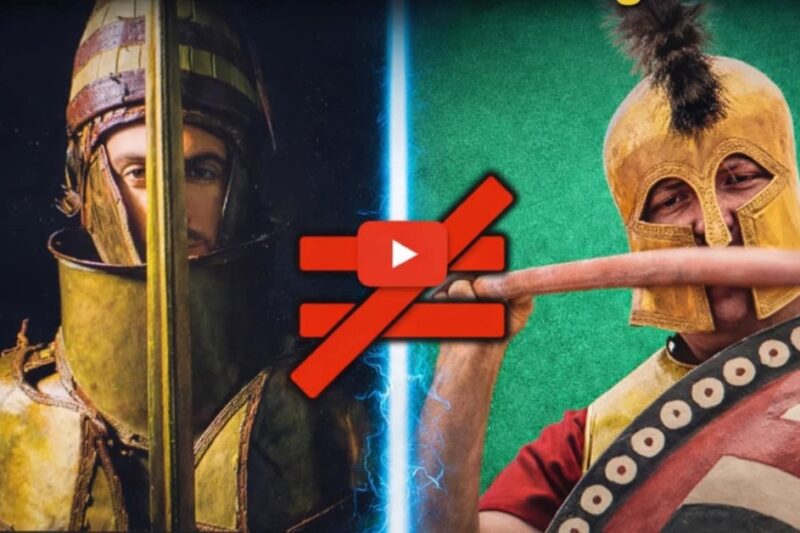 Σύγκριση που καταρρίπτει τον μύθο για τους οπλίτες στην Εποχή του Χαλκού: Αριστερά η βαριά μυκηναϊκή πανοπλία των Δενδρών και δεξιά ο κλασικός οπλίτης με το κορινθιακό κράνος, χωρισμένοι από ένα σύμβολο ανισότητας.