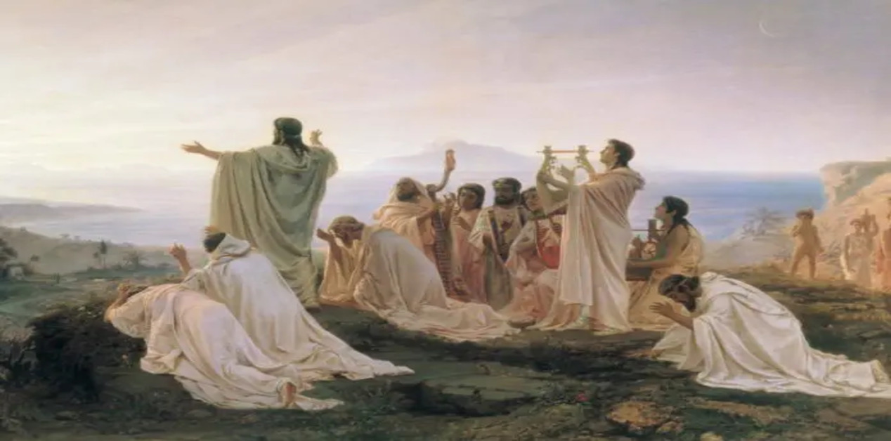 Ένας κλασικός πίνακας ζωγραφικής που απεικονίζει μια ομάδα ανθρώπων με λευκούς αρχαίους χιτώνες συγκεντρωμένους σε έναν βράχο πάνω από τη θάλασσα. Κάποιοι προσεύχονται γονατιστοί και άλλοι παίζουν λύρες, ενώ μια κεντρική φιγούρα με απλωμένα χέρια υποδέχεται το φως της ανατολής του ηλίου.